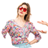 A woman wearing sunglasses and a floral shirt.

Description generated by AI